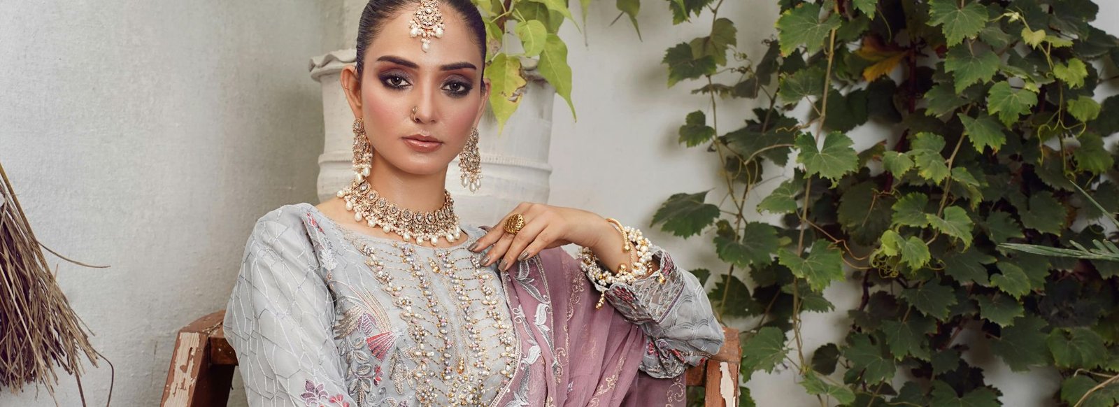 Silver embroidered ethnic outfit with a mauve dupatta